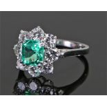 Emerald and diamond set ring, the central Columbian emerald at 1.74 carats, minor clarity