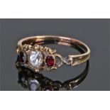 19th Century garnet set ring, with a central paste stone flanked by a pair of garnets, ring size O