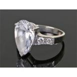 14 carat white gold ring, set with a pear cut stone, ring size P