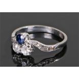 Diamond and sapphire set ring, the round cut sapphire above the two round cut diamonds with