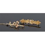 Two 9 carat gold brooches, both set with pearls, one in the form of a bow and the second with