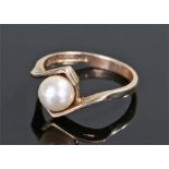9 carat gold pearl set ring, with a cross over design, ring size N