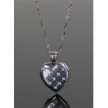 18 carat white gold and diamond set heart locket, the heart locket set with eleven round cut