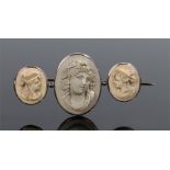 Victorian lava cameo brooch, the carved lava brooch with three classical figures, 50mm diameter