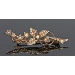 15 carat gold pearl set brooch, in the form of flowers, 45mm long