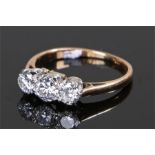 18 carat gold diamond set ring, the ring set with three round cut diamonds to the head, ring size M