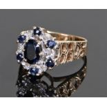 9 carat gold sapphire and diamond set ring, the central sapphire with a sapphire and diamond to form