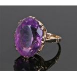9 carat gold amethyst set ring, the oval amethyst oval stone set with an eight claw mount, ring size