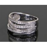 18 carat diamond set ring, consisting of four set bands each containing round cut diamonds at a