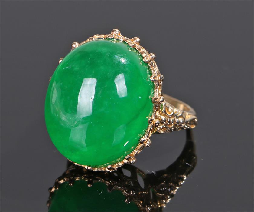 Jadeite set ring the large overall jadeite at 33.31 carat set to a yellow metal mount, ring size O