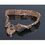 9 carat gold gate bracelet, with a padlock clasp, 11. 3 grams