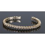 14 carat gold diamond set bracelet, the spiral bracelet set with thirty-six round cut diamonds, 17.7