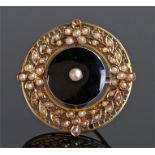 15 carat gold pearl and enamel brooch, the central pearl with an enamel ground and foliate pearls