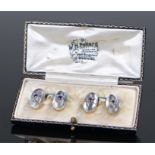 Pair of moonstone diamond and sapphire cufflinks, with oval moonstone heads and a central sapphire