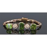 Peridot and pearl bracelet, with three emerald cut peridots and flower head pearls, 16.5cm long