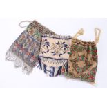 Three early 20th Century bead clutch bags, all with foliate decoration, (3)