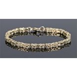 9 carat gold bracelet, with arched and bar links, 17cm long, 18.5 grams