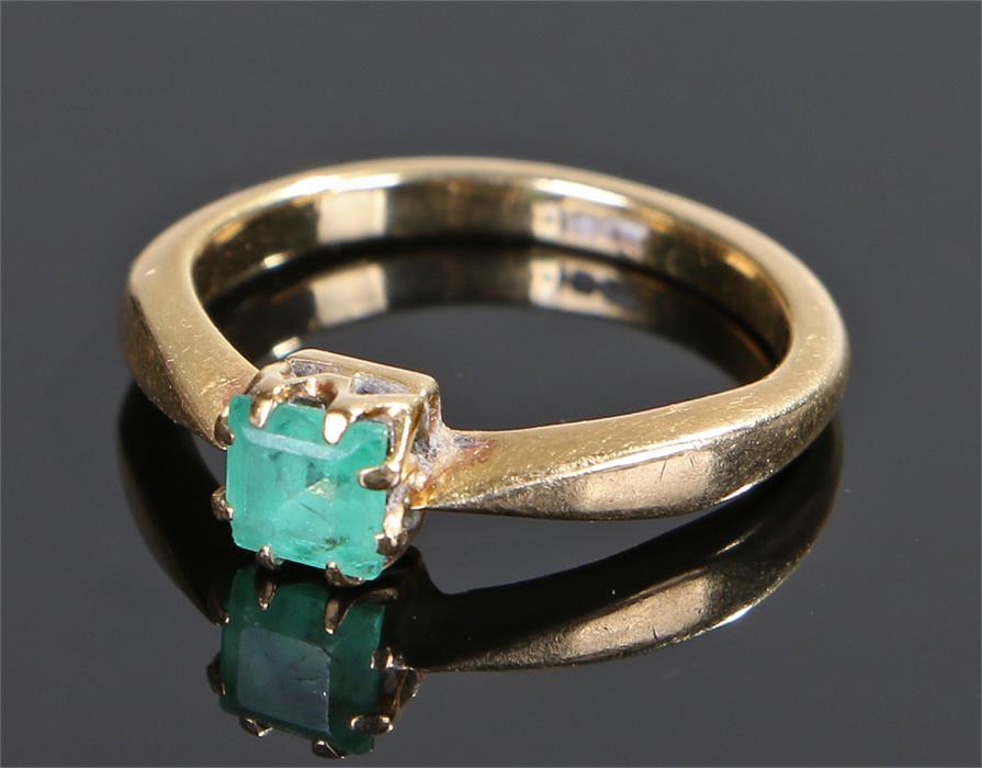 18 carat gold emerald ring, the square cut emerald with claw mounts, ring size M