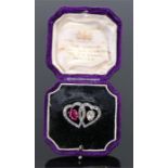 Fine Burmese ruby and diamond heart brooch, the dual hearts set with diamond to the ruby and a 1.