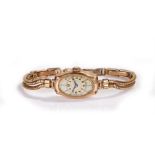 9 carat gold ladies wristwatch, the shaped rectangular dial with Arabic hours, manual wound, the