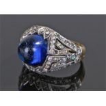 Yellow metal ring, set with a blue stone to the white head and yellow metal shank, ring size P