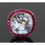 Colourless topaz and ruby brooch, the central topaz with ruby surround, 17mm diameter