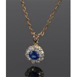 Sapphire and diamond pendant necklace, the central sapphire with a diamond surround, the pendant 8mm