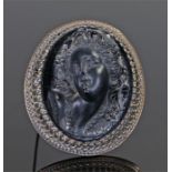 Victorian hardstone mourning brooch, carved in high profile of a lady, 46mm diameter