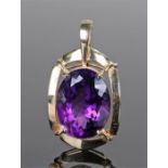 9 carat gold amethyst pendant, the oval amethyst set within the four claw mount, 50mm high