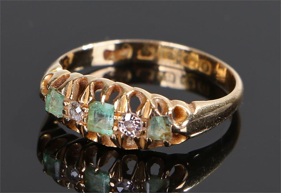 18 carat gold aquamarine and diamond set ring, set with three aquamarines and two diamonds, ring