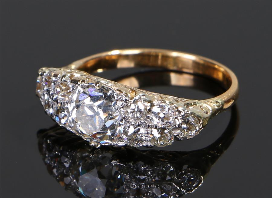 Diamond set ring, the central diamond at 1.26 carats flanked by further diamonds to make a total