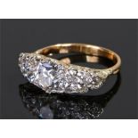 Diamond set ring, the central diamond at 1.26 carats flanked by further diamonds to make a total