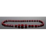 Art Deco Bakelite cherry amber necklace, with a graduated set of beads, 102cm long