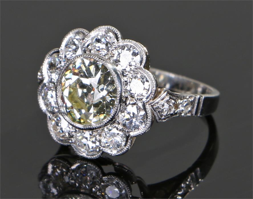 Impressive platinum and diamond set ring, the central diamond at 2.68 carats with a diamond