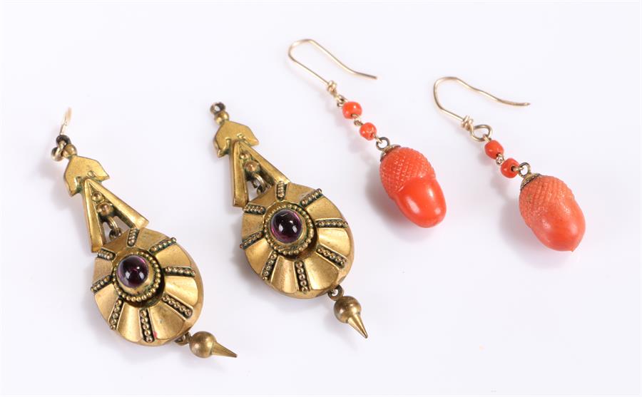 Two pairs of earrings, to include an acorn carved pair and a gold plated pair, (4)