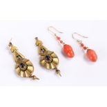 Two pairs of earrings, to include an acorn carved pair and a gold plated pair, (4)