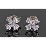 Tiffany, a pair of diamond set earrings, set as flower heads, 8mm diameter