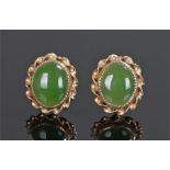 Pair of yellow metal jade set earrings, the oval jade set earrings with twist surround, 13mm