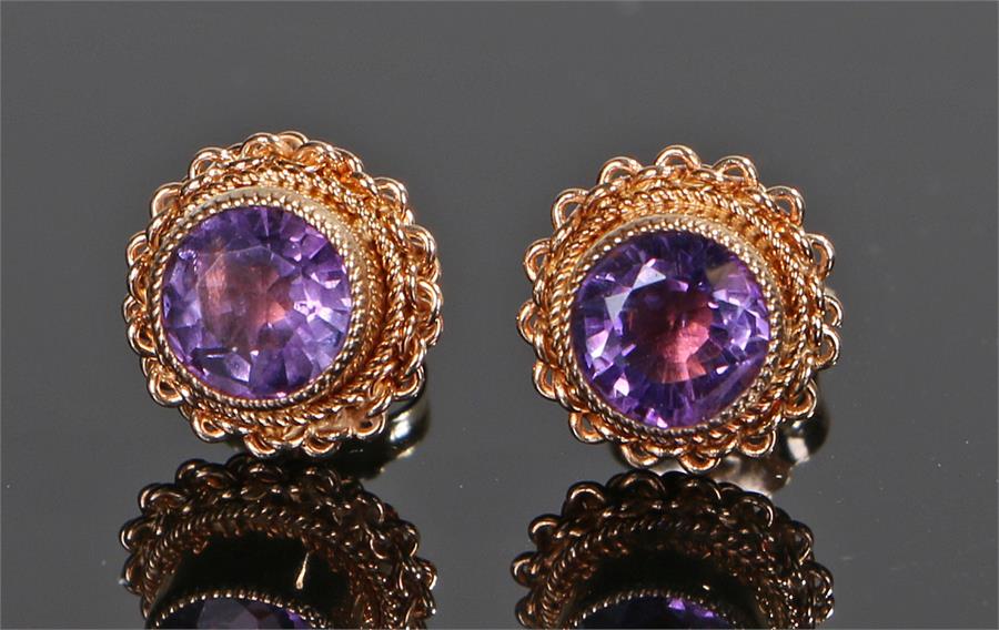 Pair of 9 carat gold amethyst set earrings, with round cut amethysts and arched surrounds, 9mm