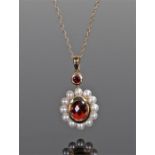 9 carat gold pearl set pendant necklace, the pendant with a central red stone and pearl surround,