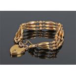 9 carat gold gate bracelet, with tapered tube links to the padlock clasp, 15 grams