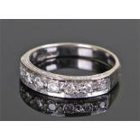 18 carat white gold diamond set half eternity ring, set with seven round cut diamonds, ring size Q