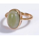 Yellow metal ring, with cabochon set stone, ring size M
