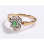 9 carat gold emerald set ring, in the form f a flower head, ting size O