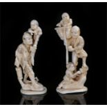 Two early 20th Century Japanese marine ivory Okimonos, with a man playing with children to each,