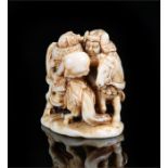 Japanese Meiji period ivory netsuke, carved as two samurai on horseback fighting, signed to the