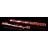 Two Meiji Senryuzutsu type pipe cases of Negoro-style lacquer smallest with raised lacquer