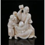 Japanese Meiji period ivory okimono, carved as four Buddhist monks reaching for a stool, 7cm high