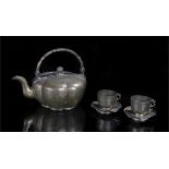 Chinese gilded teapot and cups, the teapot of globular form decorated with Chinese characters and