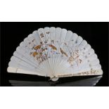 Early 20th century Japanese ivory fan, the sticks decorated in gilt with pheasants in a landscape,